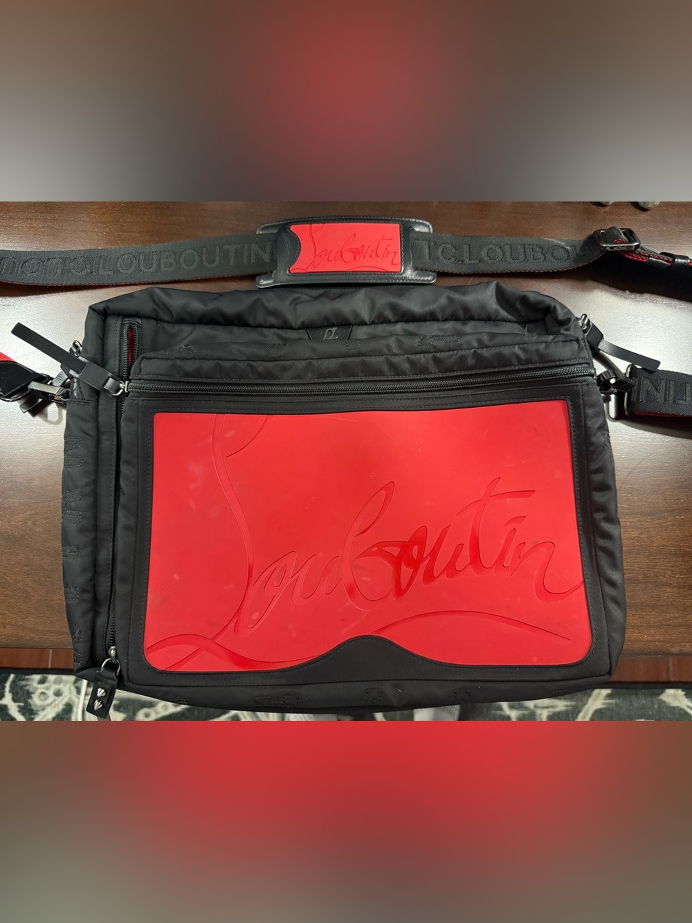 Christian Louboutin Loubideal Black Messenger Bag with Red Rubber Sneaker Panel